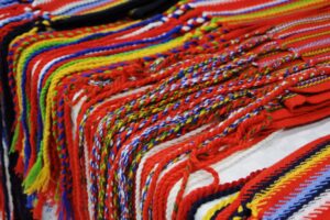 Fringe detail of assorted Metis sashes